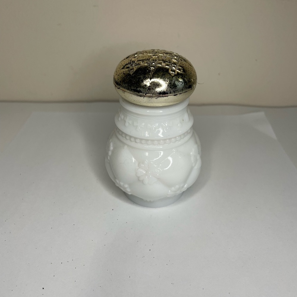 Avon milk glass powder dispenser ( empty) Vintage